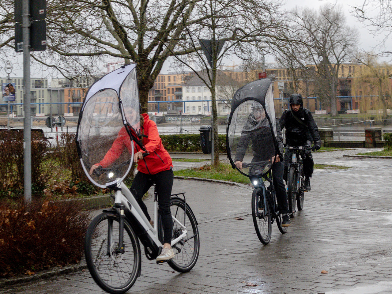 Couple rides a bike protected by Wip